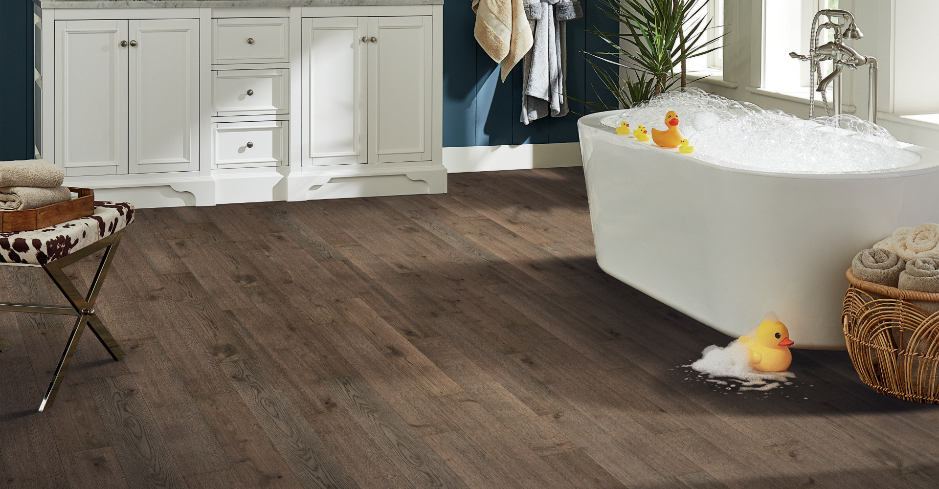 Hard surface flooring with overflowing bath tub